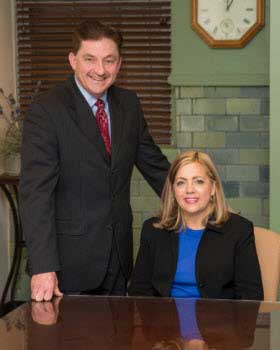 Photo of attorneys Timothy H. Barnes and Robyn Frye Honig